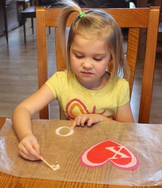 Oly-Fun Valentine's Day Banner  Gluing the letters on