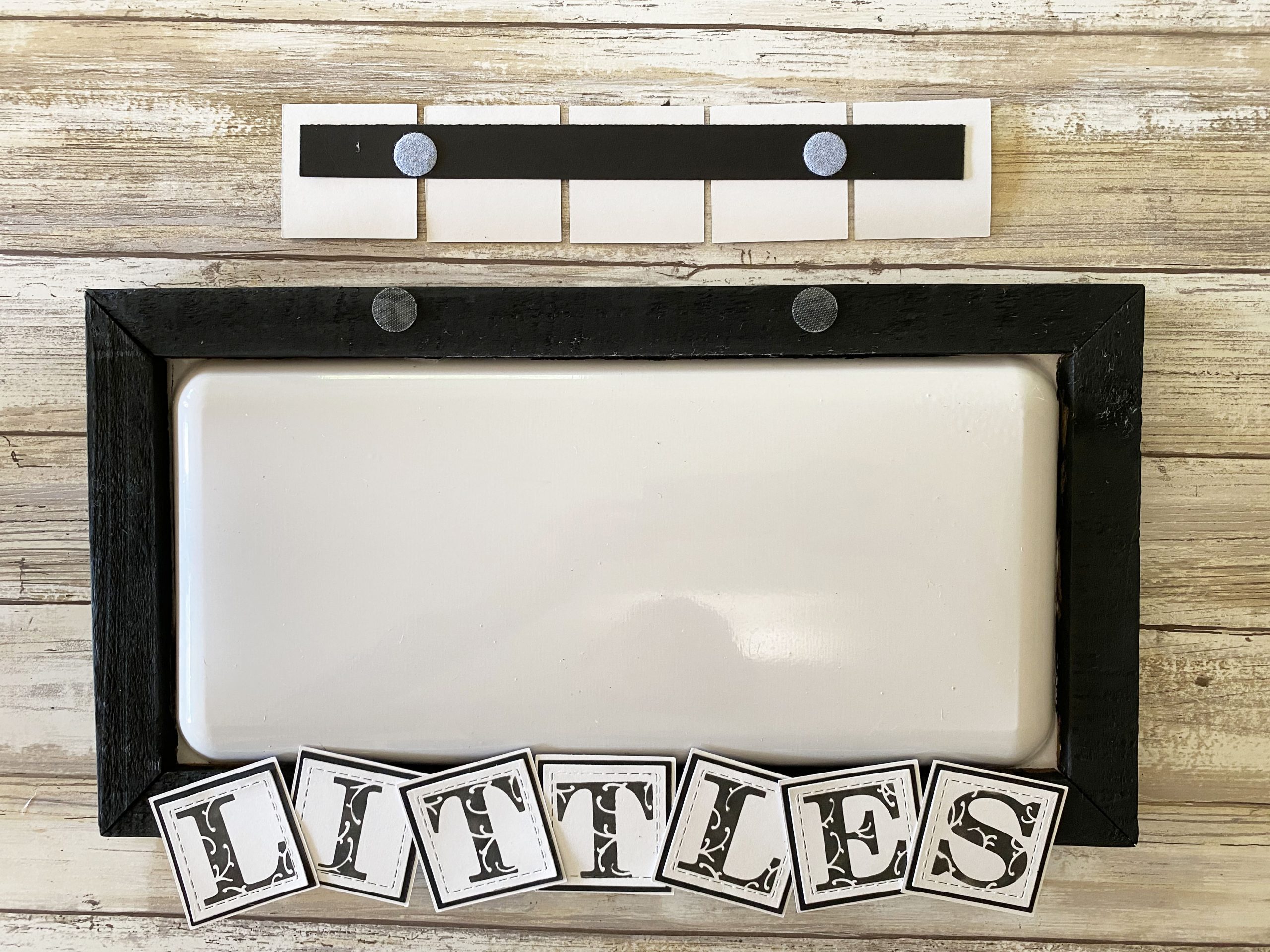 Attach the stenciled letters onto the chip board for the changeable stenciled display frame